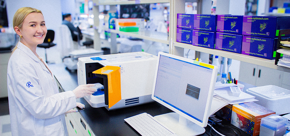 Lab technician performing a western blot service using a Protein Simple machine.